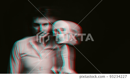 Abstract blurry portrait of a psychopathic man with mental disorders with a human skull in his hands Abstract blurry portrait of a psychopathic man with mental disorders with a human skull in his hands 93234227