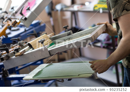 Prepare for printing and apply cloth Serigraphy silk screen print process at clothes factory 93235252