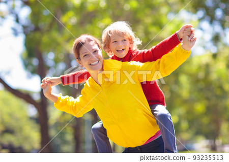 Family walking in autumn park. Fall fun. Family walking in autumn park. Fall fun. 93235513