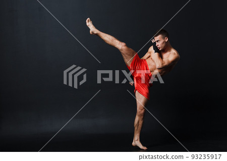 Sportsman muay thai man boxer stance at black background. Sportsman muay thai man boxer stance at black background. 93235917