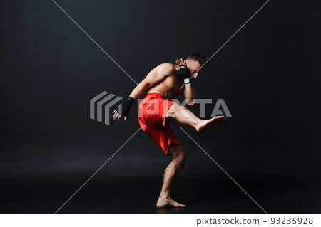 Sportsman muay thai man boxer stance at black background. Sportsman muay thai man boxer stance at black background. 93235928