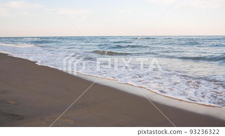Sea beach with blue sky and yellow sand and some clouds Sea beach with blue sky and yellow sand and some clouds 93236322