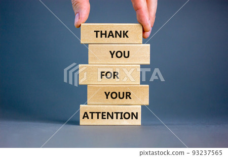 Thank you for attention symbol. Concept words Thank you for your attention on wooden blocks on a beautiful grey table grey background. Businessman hand. Business and thank you for attention concept. Thank you for attention symbol. Concept words Thank you for your attention on wooden blocks on a beautiful grey table grey background. Businessman hand. Business and thank you for attention concept. 93237565