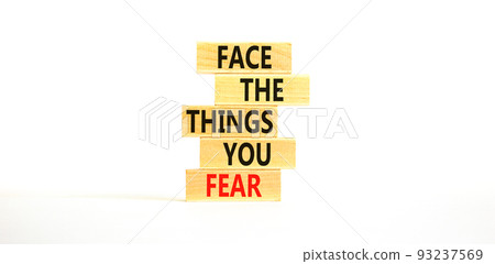 Face the things you fear symbol. Concept words Face the things you fear on wooden blocks on a beautiful white table white background. Business and face the things you fear concept. Copy space. Face the things you fear symbol. Concept words Face the things you fear on wooden blocks on a beautiful white table white background. Business and face the things you fear concept. Copy space. 93237569