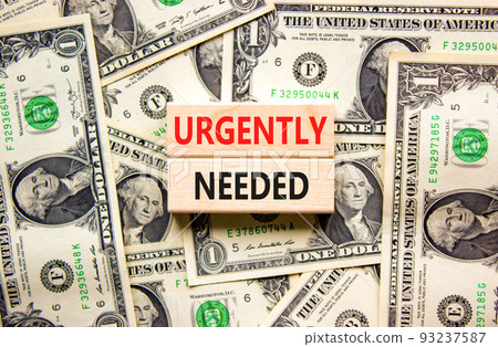 Urgently needed symbol. Concept words Urgently needed on wooden blocks on a beautiful background from dollar bills. Business and urgently needed concept. Copy space. Urgently needed symbol. Concept words Urgently needed on wooden blocks on a beautiful background from dollar bills. Business and urgently needed concept. Copy space. 93237587