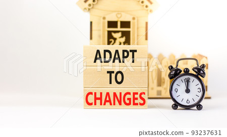 Adapt to changes symbol. Concept words Adapt to changes on wooden blocks. Black alarm clock. Beautiful white table white background. Business and Adapt to changes quote concept. Copy space. Adapt to changes symbol. Concept words Adapt to changes on wooden blocks. Black alarm clock. Beautiful white table white background. Business and Adapt to changes quote concept. Copy space. 93237631