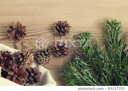 Zero waste and eco friendly christmas concept. Natural decorations and branches of a Christmas tree on the table, top view Zero waste and eco friendly christmas concept. Natural decorations and branches of a Christmas tree on the table, top view 93237701