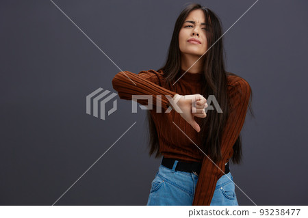 woman hand gestures brown sweater fashion Gray background woman hand gestures brown sweater fashion Gray background 93238477