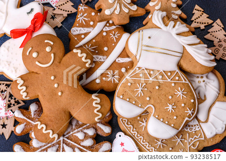 Christmas homemade gingerbread cookies on dark concrete table Christmas homemade gingerbread cookies on dark concrete table 93238517