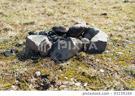 the hearth is laid out with large stones in the field 93239189