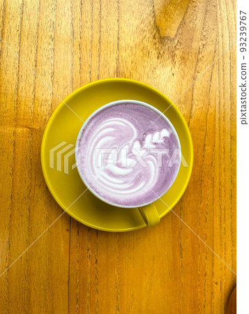 beautiful cup of Taiwanese taro milk drink with latte art in the wooden space background 93239767