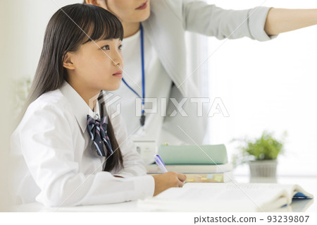 Female students taking classes at cram school Junior high school high school students 93239807