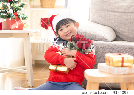 girl happy to receive a christmas present 93240931