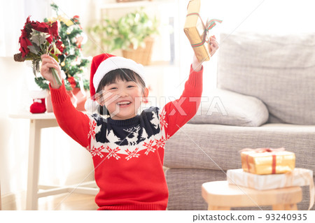 girl happy to receive a christmas present 93240935