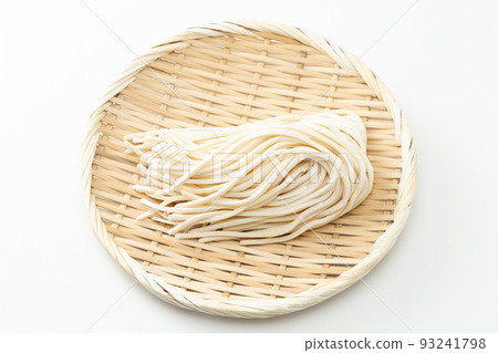 Udon in a colander, raw noodles, white background 93241798
