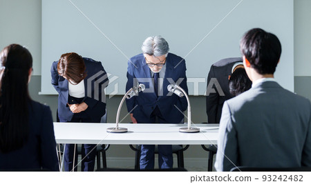 Business person holding an apology press conference 93242482