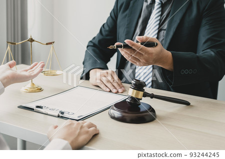 Lawyer hand holding pen and providing legal consult business dispute to the man. 93244245