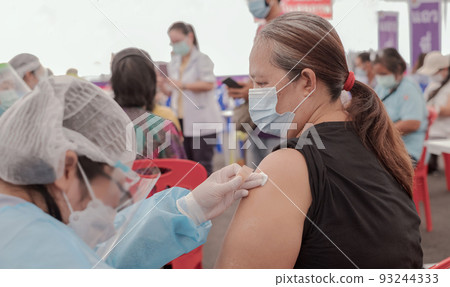 Fat Asia senior woman has gone to vaccinate coronavirus covid19 with medical staff in a field hospitel. a place set up by the government Fat Asia senior woman has gone to vaccinate coronavirus covid19 with medical staff in a field hospitel. a place set up by the government 93244333