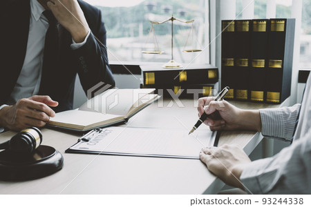 Businessman hand sign contract after lawyer providing legal consult dispute 93244338