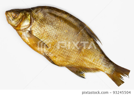 Fish Smoked bream. Isolated. Large dried salted river fish on a white background. Seafood. Good luck with the fisherman. Healthy food. Snack for beer. Big carp. Fishing on the sea and ocean. Close-up Fish Smoked bream. Isolated. Large dried salted river fish on a white background. Seafood. Good luck with the fisherman. Healthy food. Snack for beer. Big carp. Fishing on the sea and ocean. Close-up 93245504