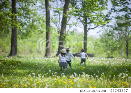 children running in the field 93245837