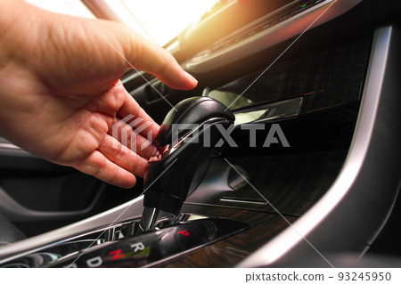 The driver is shifting automatic gear lever position. The driver is shifting automatic gear lever position. 93245950