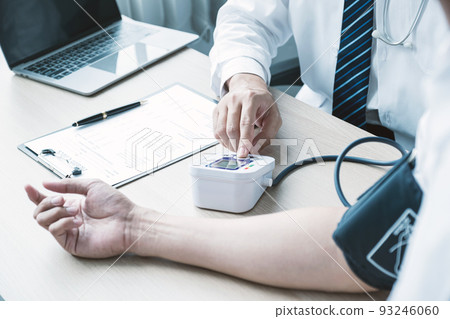 The man doctor hand use the pulse meter to measure the pressure of the patient, medical checkup concept. The man doctor hand use the pulse meter to measure the pressure of the patient, medical checkup concept. 93246060