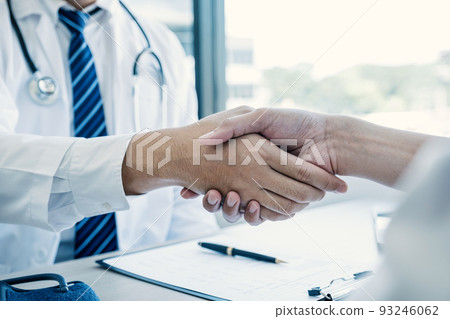 Handshake after doctor explained the health examination results to the patient, medical checkup concept. 93246062