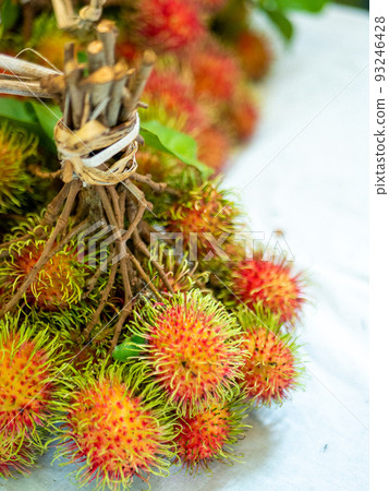 Rambutan fruit on wooden background Rambutan fruit on wooden background 93246428
