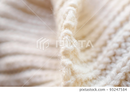 closeup beige knitted woolen fabric texture background closeup beige knitted woolen fabric texture background 93247584