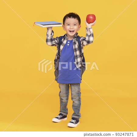 School boy with bagpack hold apple book isolated School boy with bagpack hold apple book isolated 93247871