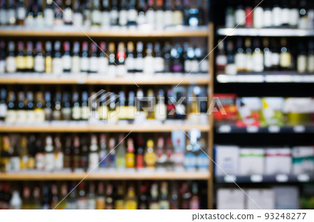 Abstract blur wine bottles on liquor alcohol shelves in supermarket background 93248277