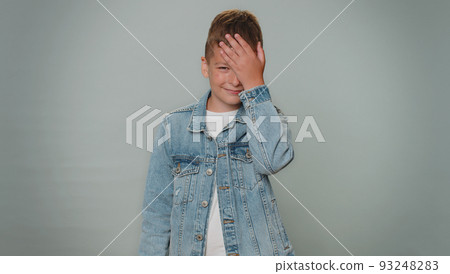 Upset toddler stylish boy making face palm gesture, feeling bored, disappointed in result, bad news 93248283