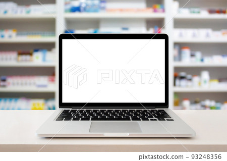 pharmacy store with laptop computer on medical counter 93248356