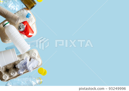 Recycling concept - levitation of recyclable materials on bright background 93249996