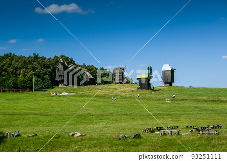 Wooden windmills in the village 93251111