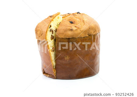 Classic panettone with dried fruit ,traditional Italian Christmas cake on white background. In front a sliced part of cake. Classic panettone with dried fruit ,traditional Italian Christmas cake on white background. In front a sliced part of cake. 93252426