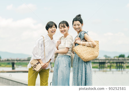 Woman enjoying a trip with her friends 93252581