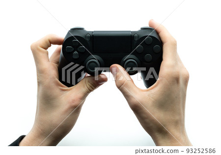Gamer hand holding black joystick on white background. Concept cybersport. Gamer hand holding black joystick on white background. Concept cybersport. 93252586