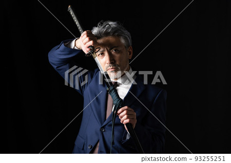 A man with a Japanese sword Black background 93255251