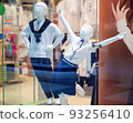 Mannequins in the shop window dressed in school uniforms 93256410