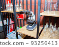 Electron microscope stands on the shelf of the scientific laboratory 93256413