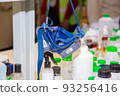 A laboratory respirator hangs over a desk in a science lab 93256416
