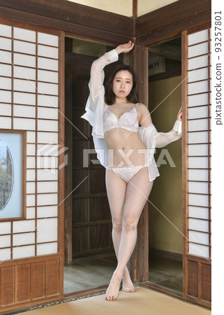 A young woman in white lingerie posing in a Japanese-style room in an old private house 93257801