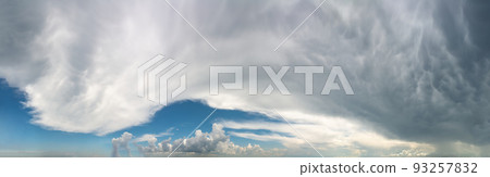 Fantastic clouds against blue sky, panorama 93257832