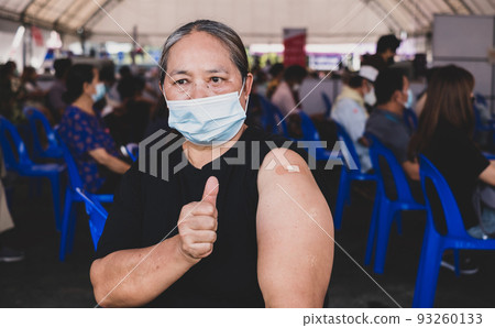 Fat woman showing thumbs up has gone to vaccinate coronavirus covid19 shoulder with bandage on orange background, Healthcare And Inoculation Concept Fat woman showing thumbs up has gone to vaccinate coronavirus covid19 shoulder with bandage on orange background, Healthcare And Inoculation Concept 93260133