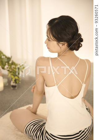 Back view of a young woman doing skin care Back view of a young woman doing skin care 93260571