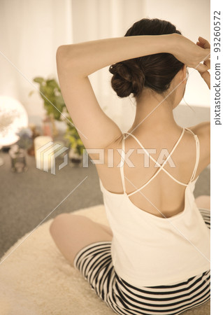 Back view of a young woman doing skin care Back view of a young woman doing skin care 93260572