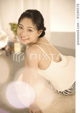 Back view of a young woman doing skin care Back view of a young woman doing skin care 93260579