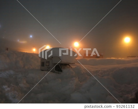 Motor home covered in snow. A recreational vehicle camper in snowdrift. Car caravan trailer in a snowdrift. Snowy motorhome. Car caravan trailer covered with snow. Blurred image 93261132